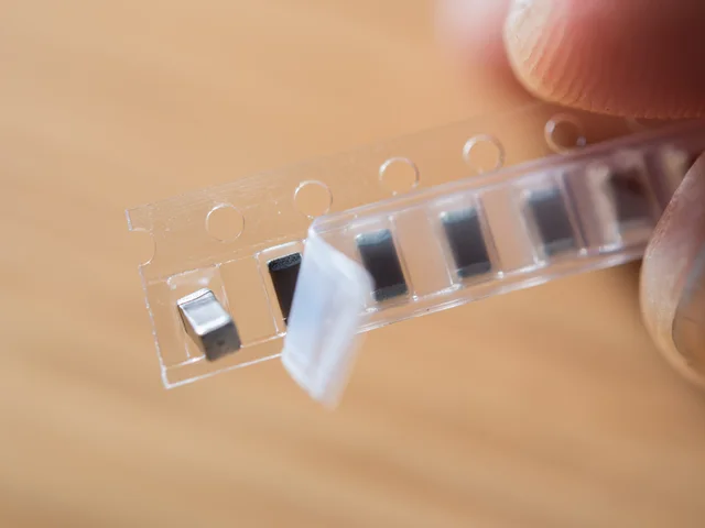 SMT tape and reel packaging for automated surface mount kitting and consolidation